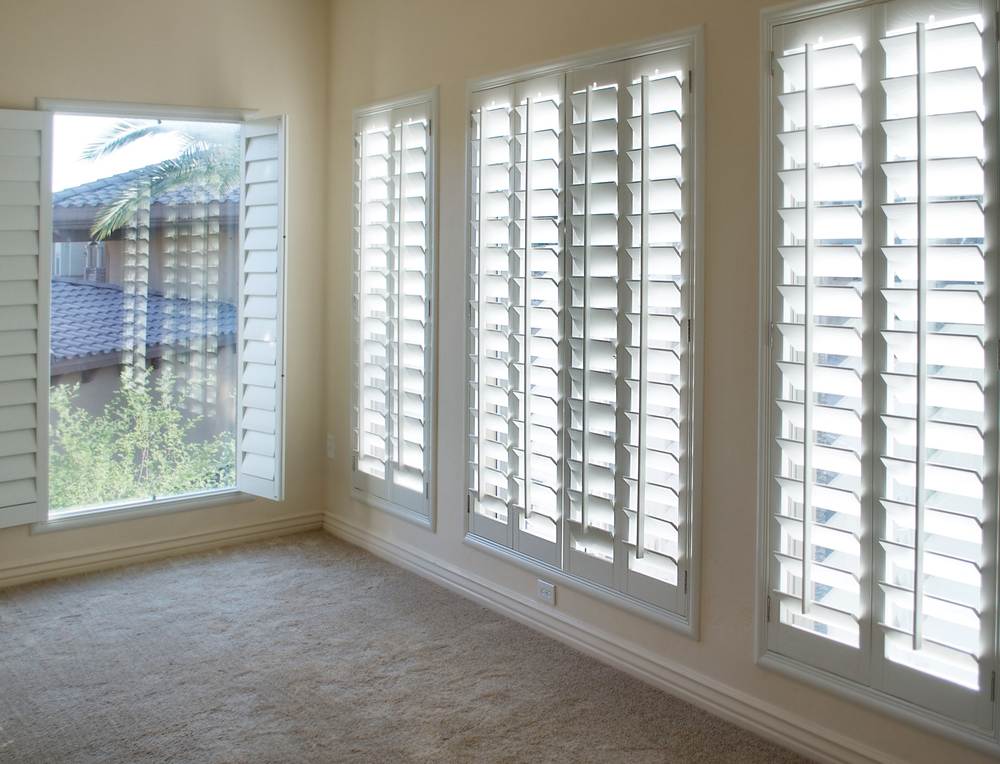A picture of a living room plantation shutters