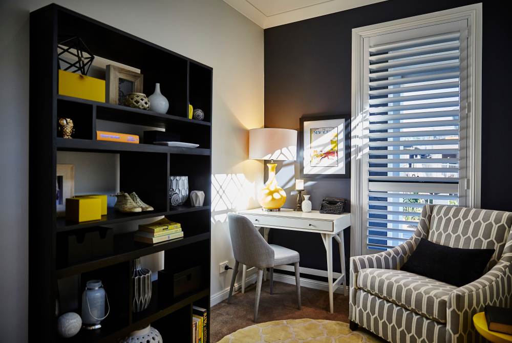 A picture of a plantation shutters in a home office